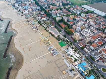 Bathing beach in Rimini. Bathing beach on the Adriatic in bad weather. All deckchairs are free.