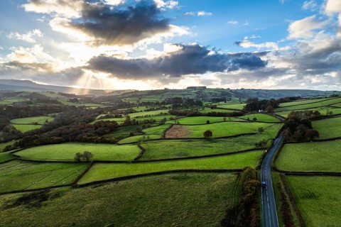 Farms over Trecastle from a drone at sunset, Brecon Beacons National Park, Powys, Wales, England,