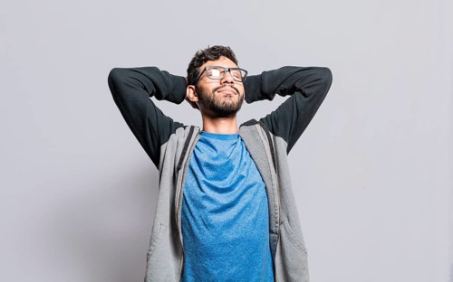 Relaxed person with closed eyes with hands behind his head isolated, Satisfied person with hands