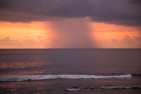 Rainstorm and clouds at sea at sunset viewed from Galle, Sri Lanka, Asia