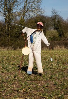 Scarecrow standing in field, Lindsey, Suffolk, England, UK