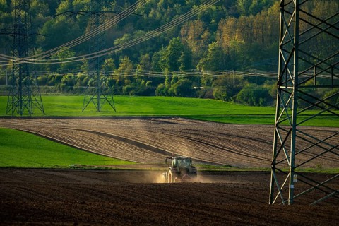 Tractor working a field near Grevenbroich, in spring, Germany, Europe