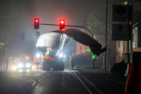 Transport of a 68 metre long, 22 tonne blade of a wind turbine, here in Breckerfeld, with a