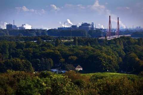 View from the Rheinpreussen spoil tip in Moers to the ThyssenKrupp plant with the bridge of the A