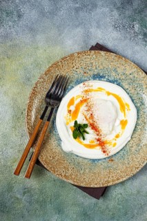 Cilbir, traditional Turkish breakfast, Turkish eggs with yogurt and butter, homemade, no people