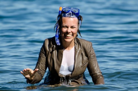 Elegant and Happy Business Wet Woman in the Water with a Diving Mask and a Elegant Suit in