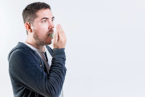 Person with bad breath problem isolated. Man with latisosis checking bad breath