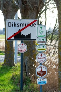Bike node sign and 14-18 front route signposts giving directions for cycling routes, bicycle