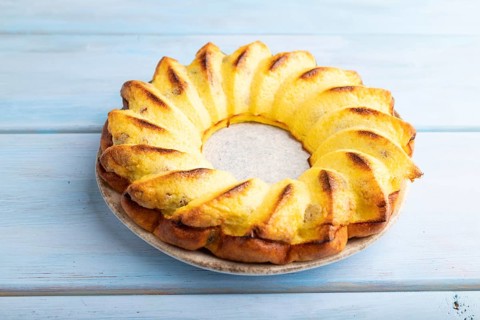 Cheesecake on blue wooden background. side view, close up