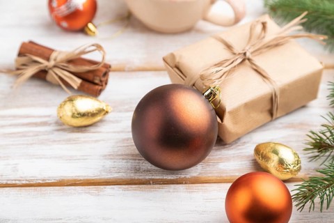 Christmas or New Year composition. Decorations, box, golden balls, cinnamon, fir and spruce