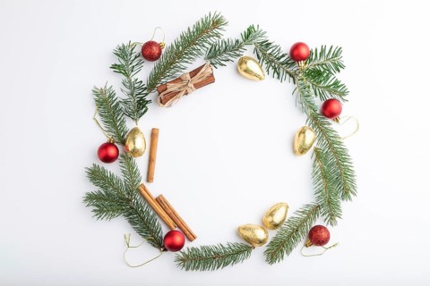 Christmas or New Year wreath composition. Decorations, balls, fir and spruce branches, on white