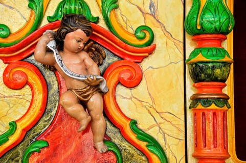 Wooden figure of a cherub at an old carousel organ or fairground organ, historic Wies'n, Oide
