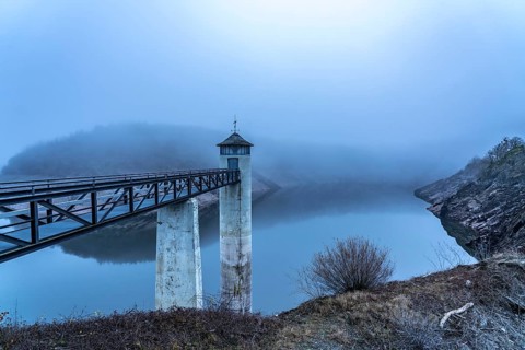 The dam wall of the Urft dam, in the Eifel, reservoir, in winter, fog, near Schleiden, North