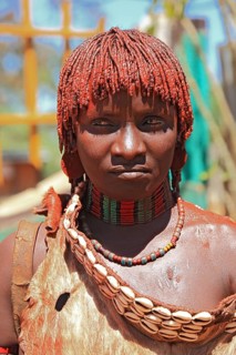 Southern Ethiopia, woman of the Hammer people in Dimeka, dress made of goatskin and hair dyed with