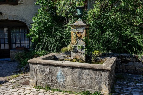 Old historic fountain with curved tap Water spout for permanent drinking water supply Clean