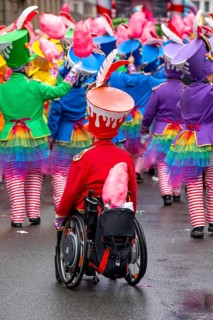 Rose Monday parade in Düsseldorf, street carnival, foot groups, carnivalist in a wheelchair