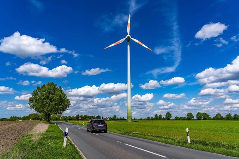 Wind turbine, wind energy plant from the manufacturer Enercon, blue sky with many white clouds,