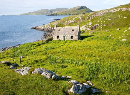 Deserted derelict croft cottage in coastal location on Vatersay Island, Barra, Outer Hebrides,