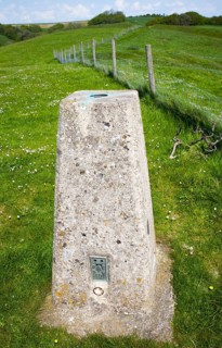 Concrete triangulation pillar on chalk hilltop Giant's Grave, near Oare, Wiltshire, England, UK