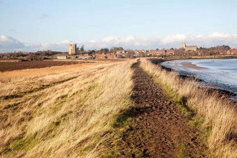 View of the village and castle looking across fields, Orford, Suffolk, England, United Kingdom,