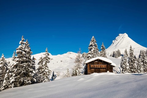 Snow-covered mountains and mountain hut, Damülser Mittagspitze, Damüls, Bregenzerwald, Vorarlberg,