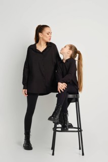 A modern family relations. Mother and daughter blowing an air kiss to each other