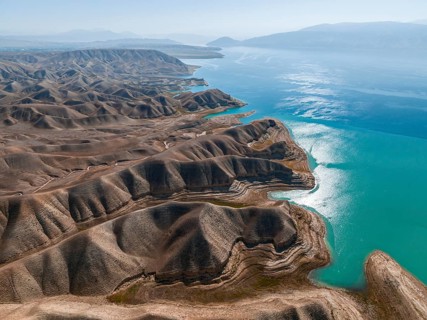 Barren landscape, aerial view, erosion landscape with canyons on the Naryn River, Toktogul