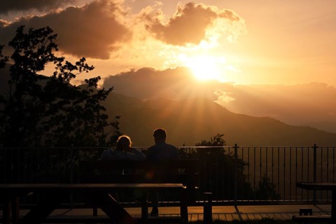 Couple watches the sunset on mountains, Sepino, Molise, Italy, Europe