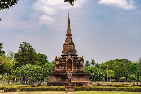 Buddha statue and chedi of the Buddhist temple Wat Sa Si, UNESCO World Heritage Sukhothai
