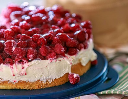 A fresh, creamy raspberry tart with fresh raspberries and cream