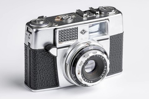 An old Agfa camera on a white background