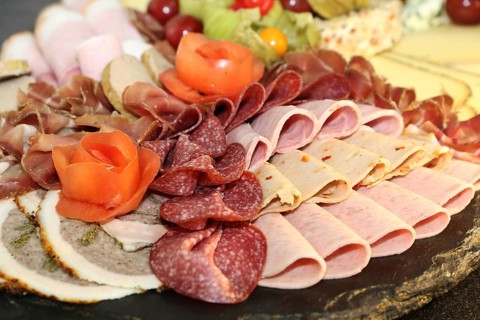 Party service: Cold platter with cheese, ham and grapes