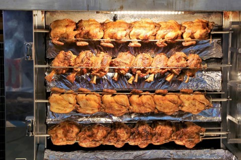 Grilled knuckle of pork and chicken on the spit