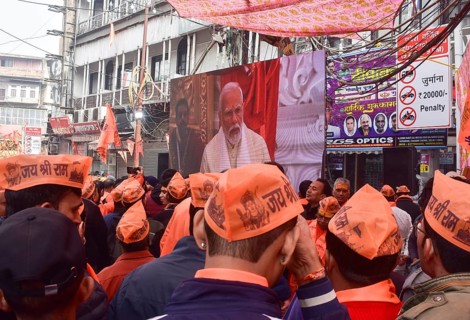 People watch live broadcast of the consecration ceremony of the Ram temple, in New Delhi, India on