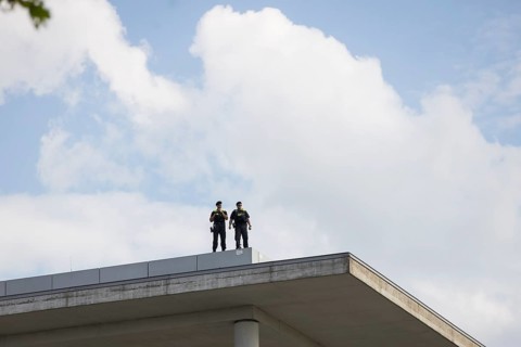 Two police officers observe the citizens' festival Celebrating democracy. / The Basic Law turns 75,