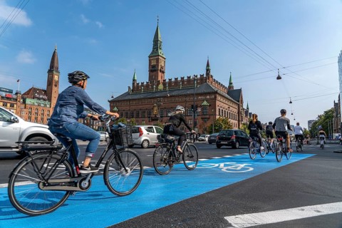 Cyclists on cycle paths, Radhuspladsen, City Hall Square, in the city centre of Copenhagen,