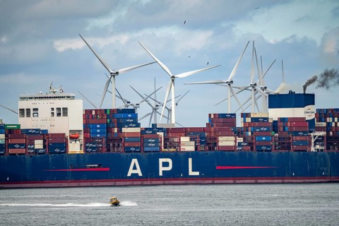 Entrance to the seaport of Rotterdam, APL Raffles container freighter, entering Maasvlakte 2, wind