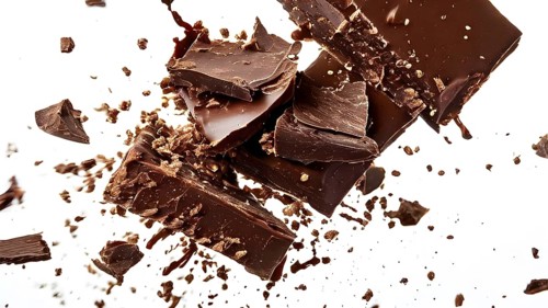 Milk chocolate bar exploding into fragments against a dark backdrop, AI generated