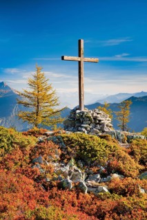 View of the Valais mountains and the Rhone valley with summit cross in autumn, Lower Valais,