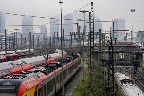 Railway tracks with regional and long-distance trains, ICE, after freezing rain, in front of