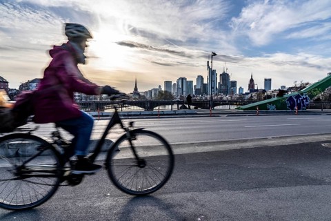 Skyline of Frankfurt am Main, skyscrapers, cyclists on the Flößerbrücke, Hesse, Germany, Europe