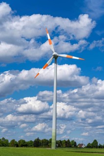 Wind turbine, wind energy plant from the manufacturer Enercon, blue sky with many white clouds,