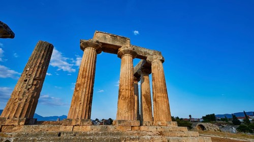 Archaic Temple of Apollo, Doric columns, The majestic ruins of an ancient temple under a clear blue