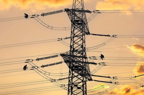Overhead line fitters working on a high-voltage pylon, overhead lines, energy, worker, high-voltage