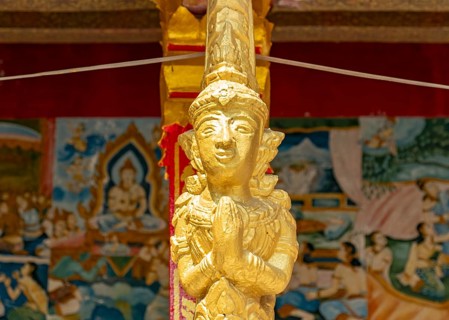 Gilded deity statue, Wat Phonxay, Luang Prabang, Laos, Asia