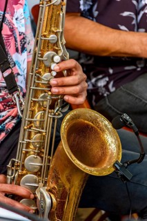 Saxophonist and group of musicians during a musical performance on the streets of Recife, Recife,