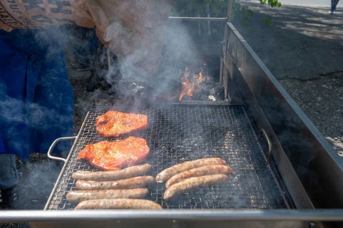 Roast sausages and pork steak on a charcoal grill, Kirchweih in Franconia, Bavaria, Germany, Europe