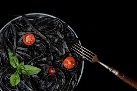 Black pasta coloured with squid ink and fork, Taglioni al Nero di Seppia, Italy, Europe