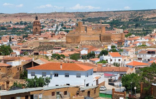 Panoramic view of a historic city with an old fortress, red roofs and arid surroundings, Cathedral,