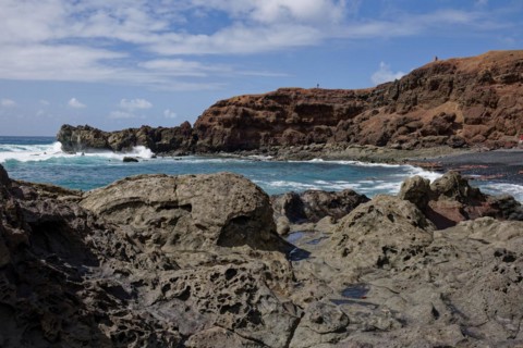 Lava rocks at the Playa de los Ciclos near the Green Lake, Lago Verde, El Golfo, Lanzarote, Canary